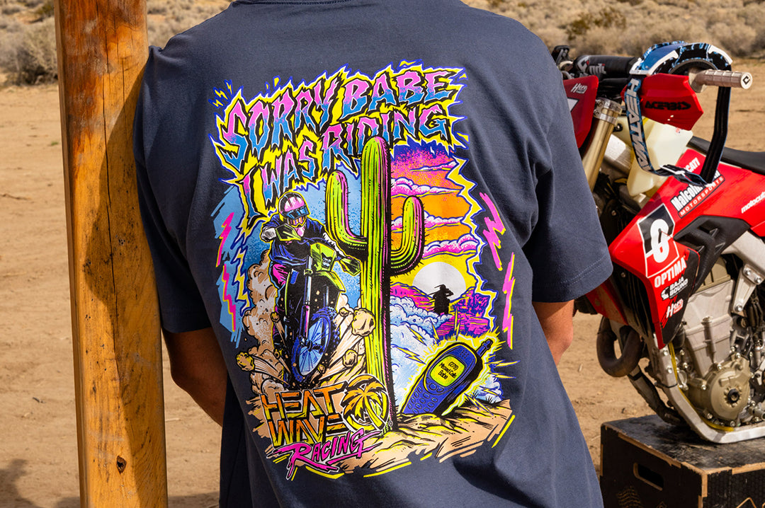 Person wearing the Heat Wave "Sorry Babe" T-Shirt in a desert setting