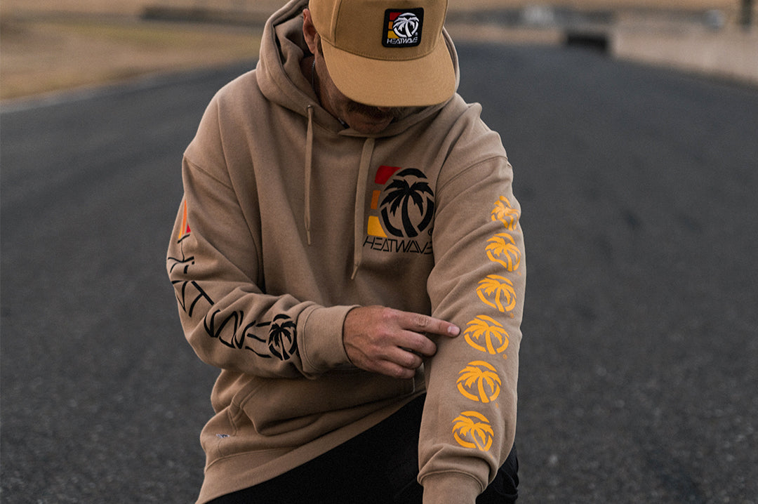 Man wearing the Heat Wave 3 Stripe Sweatshirt - Sandstone