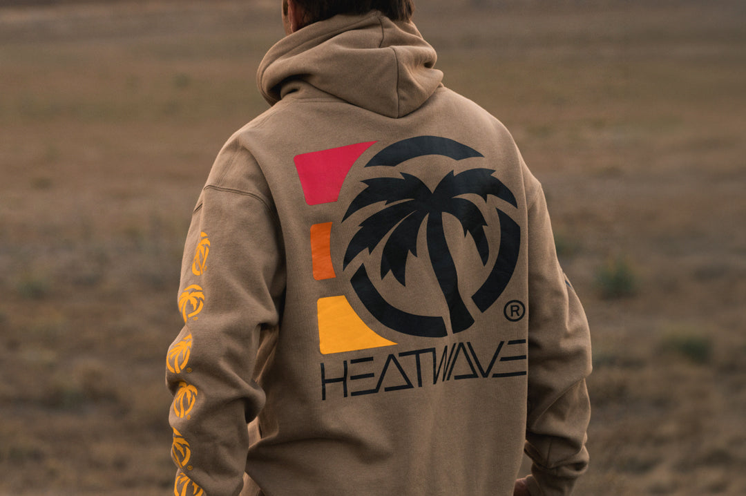 Man wearing the Heat Wave 3 Stripe Sweatshirt - Sandstone showing the backside