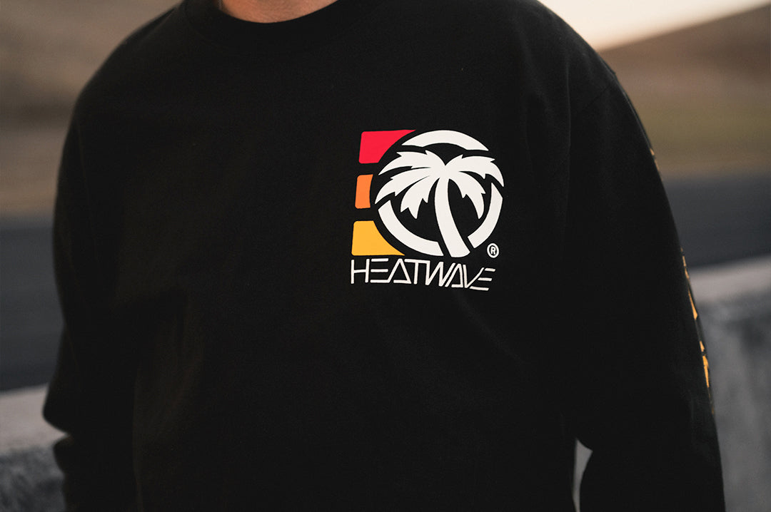 Close up of the Heat Wave 3 Stripe Long Sleeve T-Shirt - Black logo