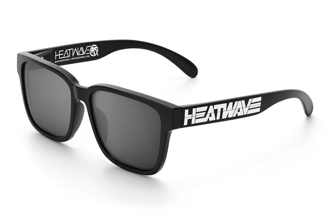 Heat Wave Visual Apollo Sunglasses with black frame, white billoard logo print arms and silver lens.