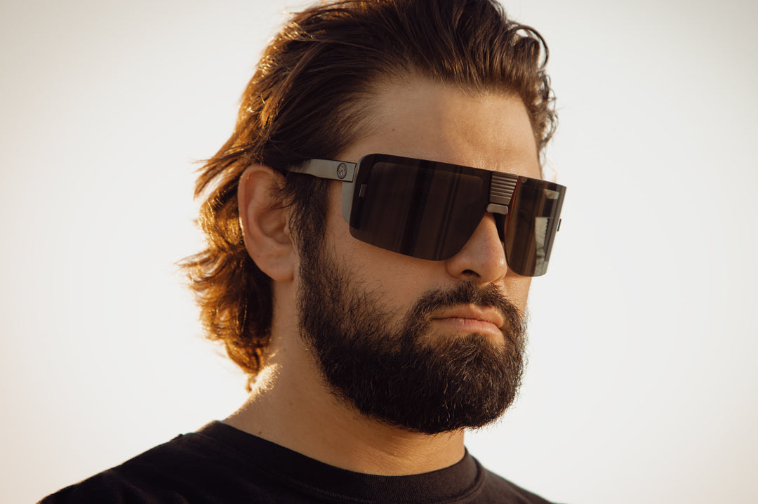 Esmarco wearing the Heat Wave Visual Vector Sunglasses with black frame and ultra black lens.