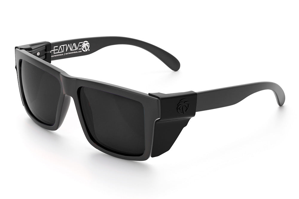 Heat Wave Visual Vise Z87 Sunglasses with rubberized frame, black lenses and black side shields.