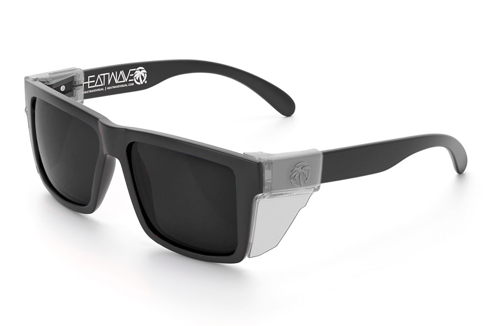Heat Wave Visual Vise Z87 Sunglasses with rubberized frame, black lenses and clear side shields.