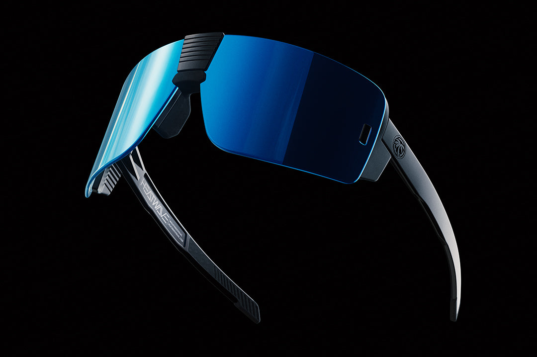 Floating in space are Heat Wave Visual XL Vector Sunglasses with galaxy lens.