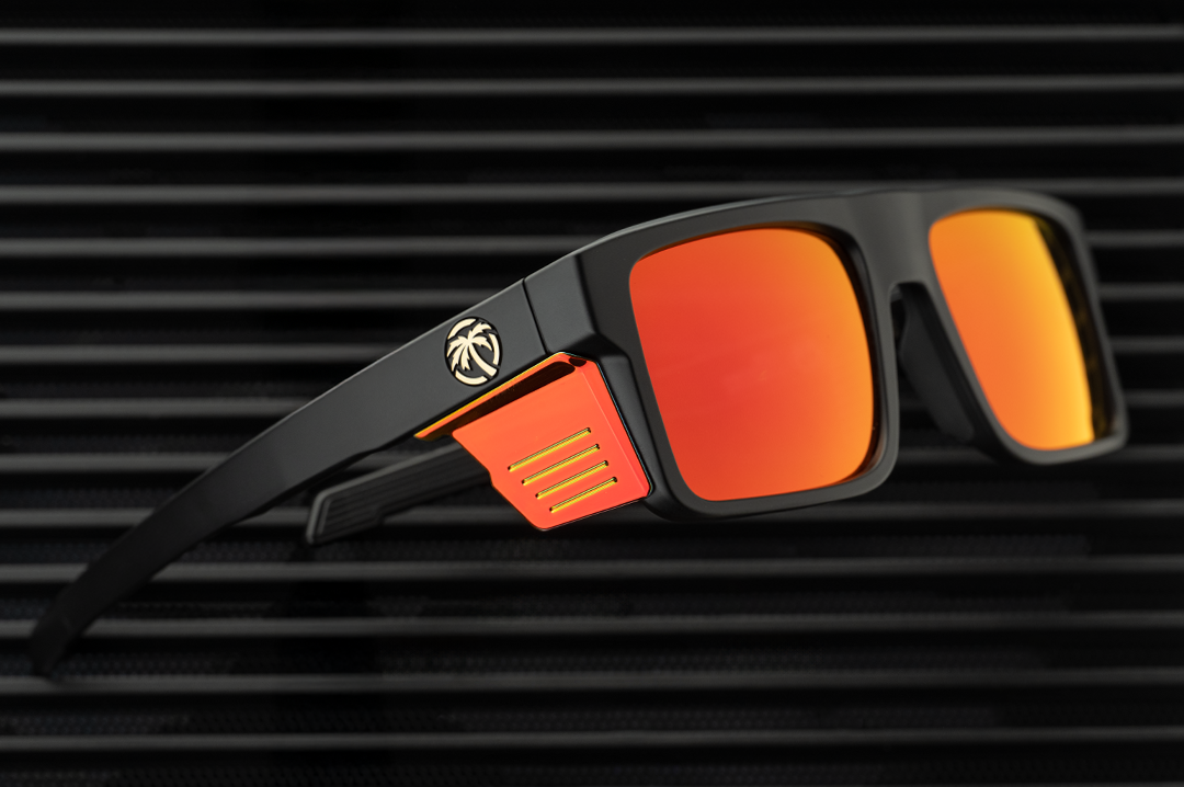 Lying on a radiator is the Heat Wave Visual Performance Rayth Sunglasses with Firestorm red lenses.