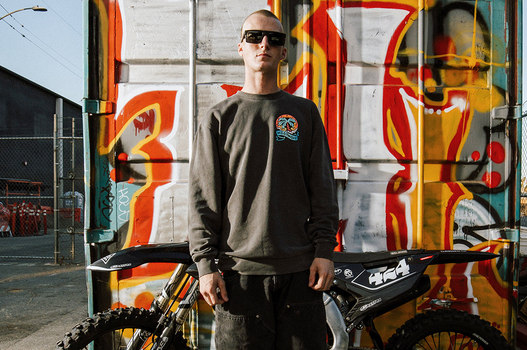 Man wearing the Heat Wave x Tall Boy Flash Crewneck Sweatshirt - Black