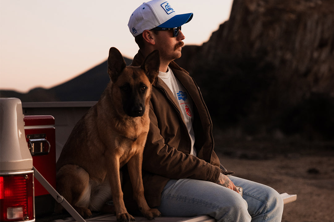 Male model wearing Heat Wave Visual Vise Sunglasses with black frame, Chevy Truck print arms and Galaxy lens.