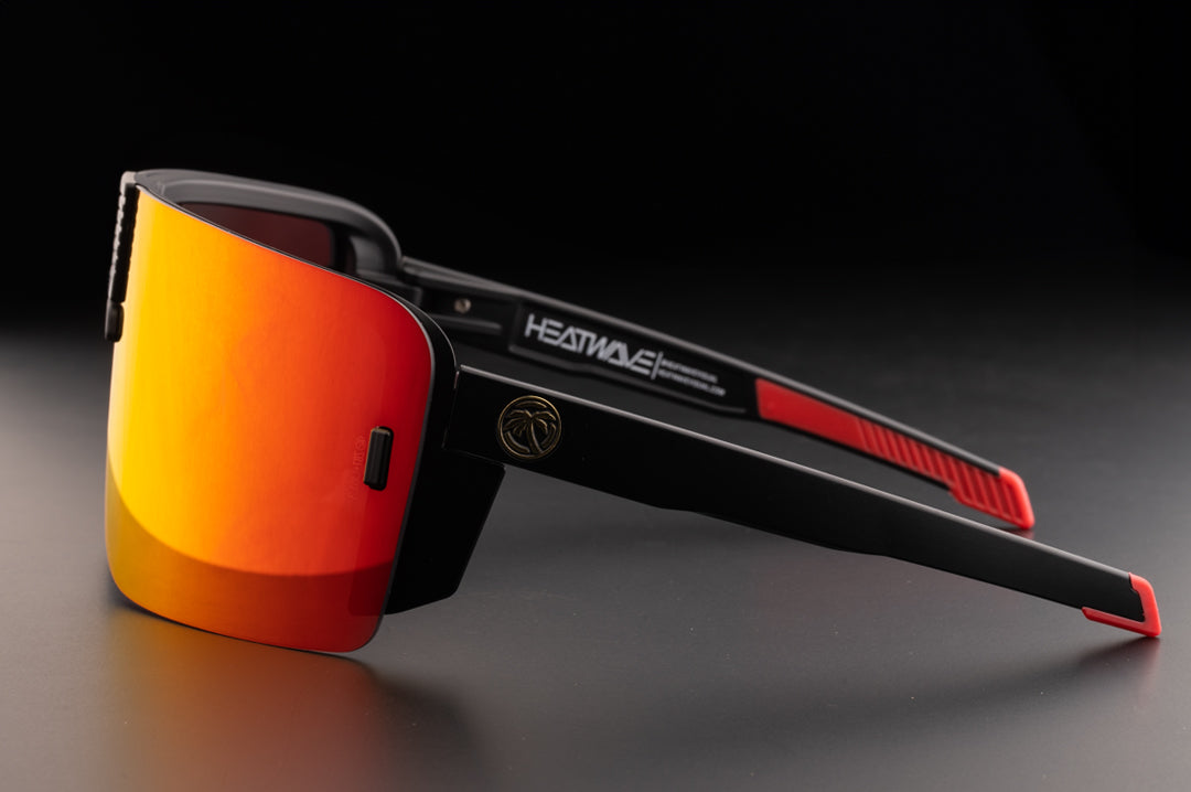 Side view of the Heat Wave Visual XL Vector Sunglasses with black frame and firestorm red lens.