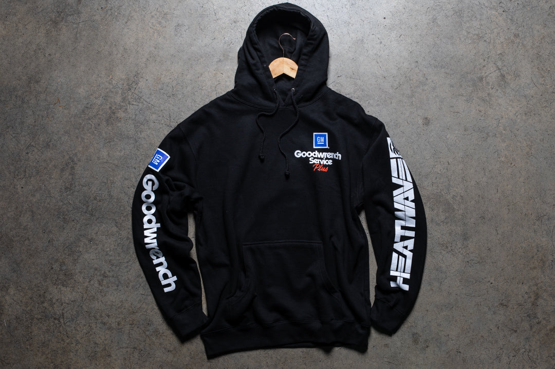 Laying on the ground is the Heat Wave Visual GM Goodwrench sweatshirt.