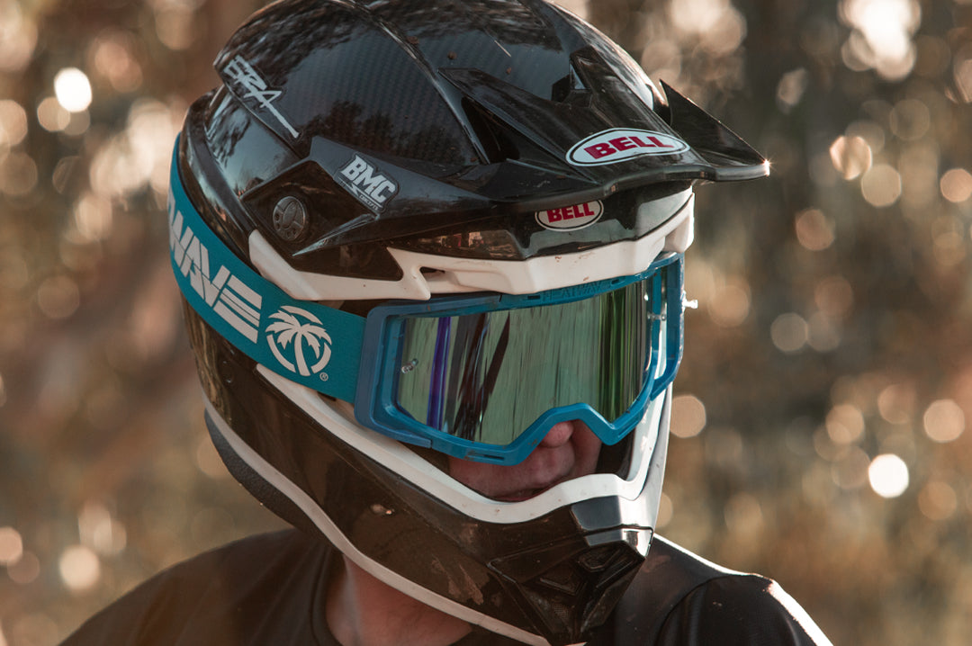 Rider wearing the Heat Wave Visual MXG 250 Motosport Goggle in the billboard icon arc flash blue color way. 