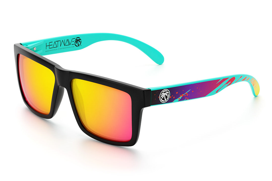 Heat Wave Visual Vise Sunglasses with black frame, aqua splash print arms and tropic pink yellow lenses.