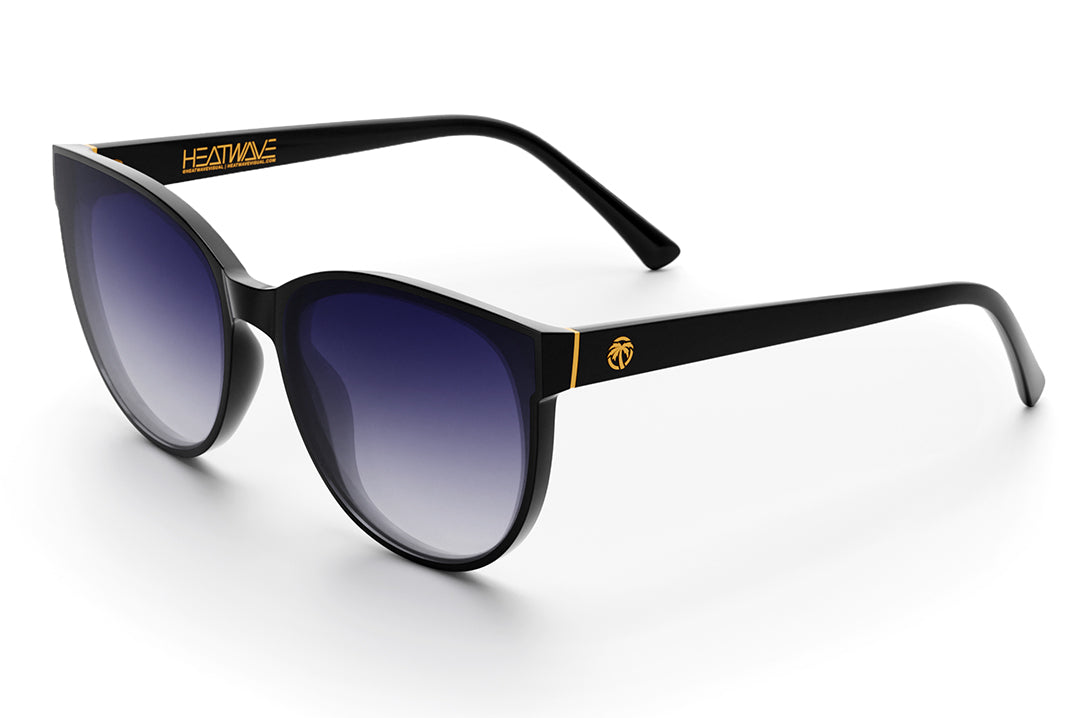 Heat Wave Visual Womens Carat Sunglasses with black frame and purple gradient lenses.
