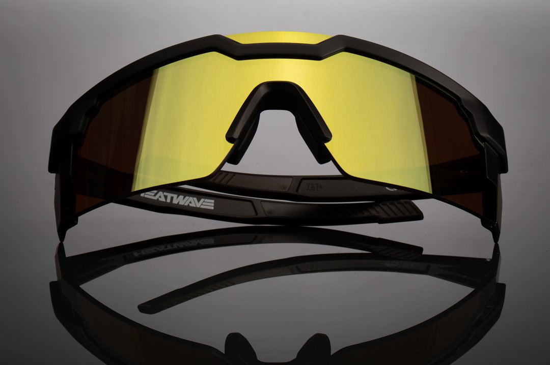 Front of Heat Wave Visual Future Tech Sunglasses with black frame and gold lens.