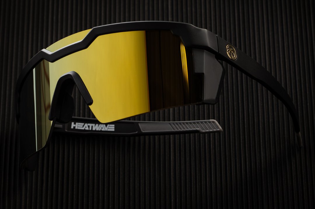 Heat Wave Visual Future Tech Sunglasses with black frame and gold lens.