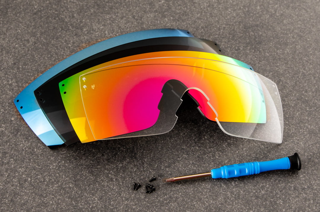 Heat Wave Visual Lazer Face replacement lenses lying on concrete.