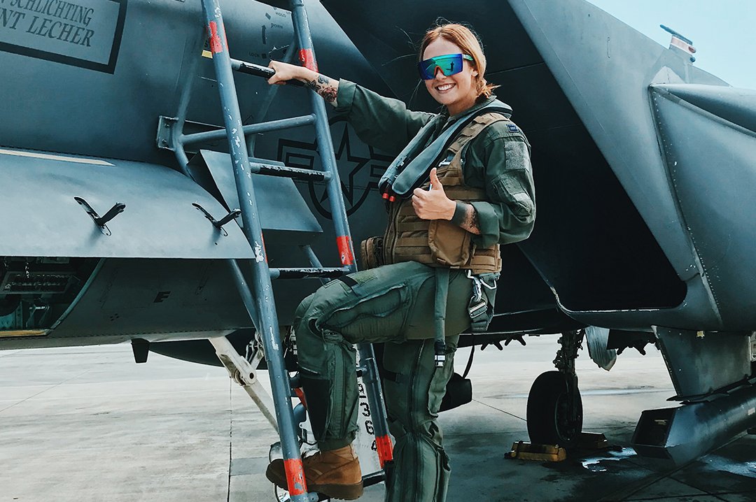 Women Pilot wearing Heat Wave Visual Lazer Face Z87 Sunglasses with black frame and piff green lens.