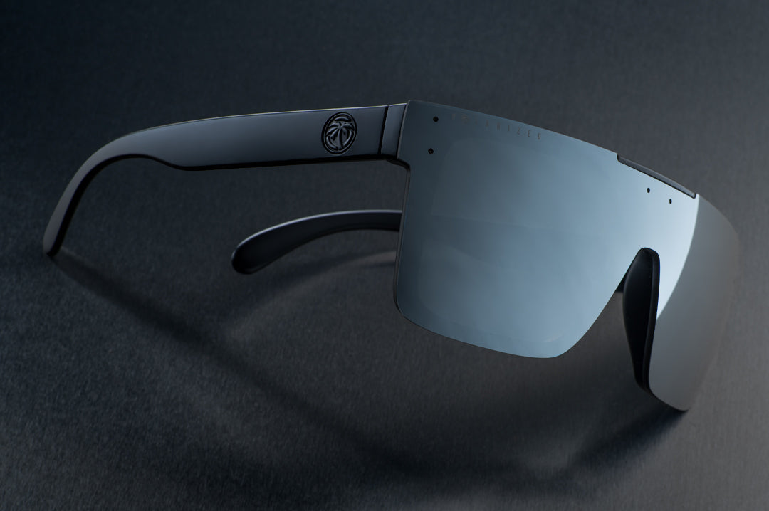 Side view of Heat Wave Visual Quatro Sunglasses with black frame and silver lens.