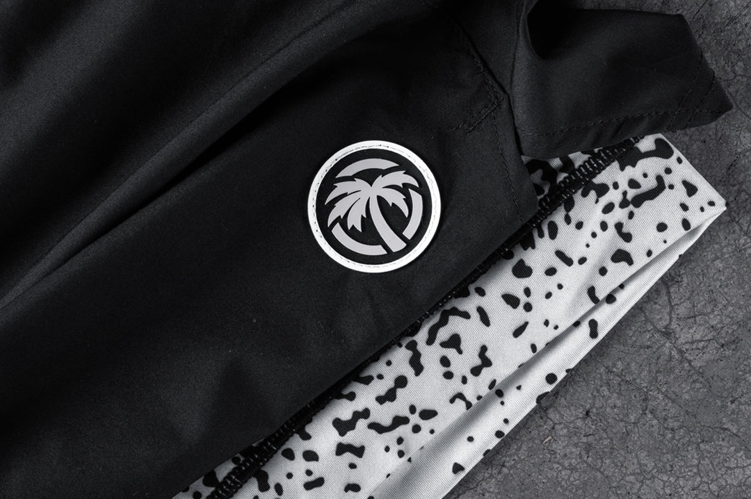 Close up shot of the Heat Wave Alloy Performance Shorts on a concrete floor.