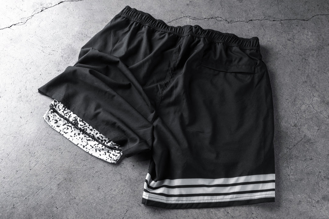 Backside shot of the Heat Wave Alloy Performance Shorts on a concrete floor.