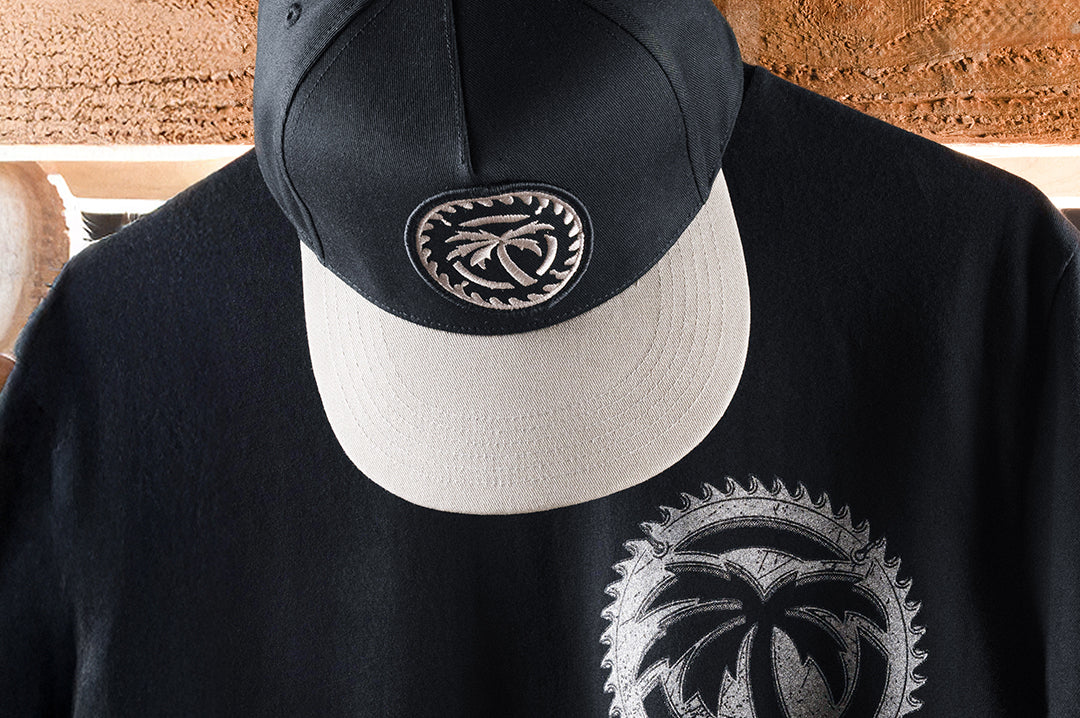 Black Snapback Hat with Silver Embroidered Patch