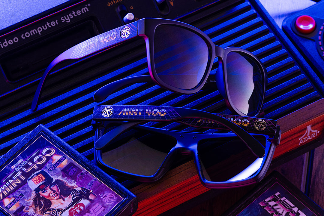 Sunglasses with 'Mint 400' branding on a vintage Atari computer system.