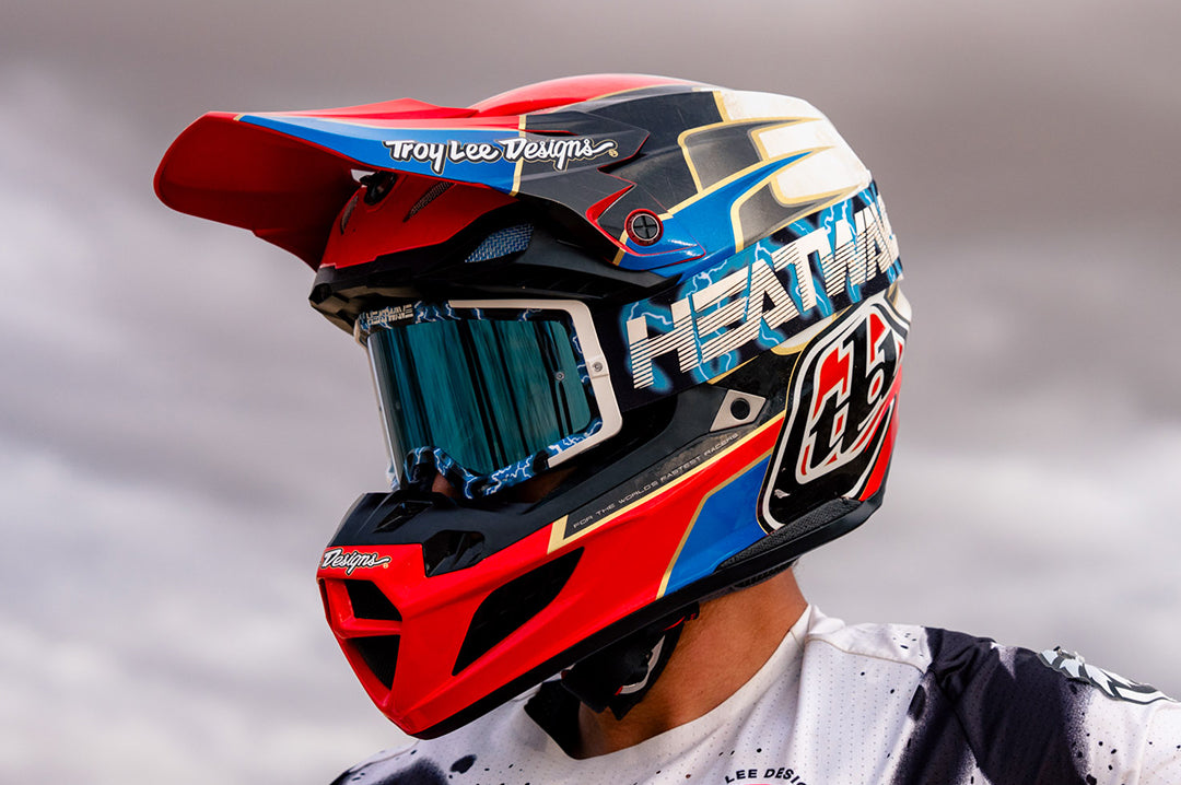 Action shot of a man in the desert wearing the Heat Wave Visual MXG 250 Motosport Goggle in the Lightning color way.