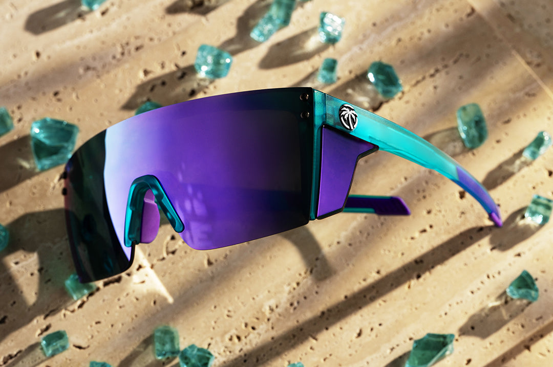 Heat Wave Performance XL Lazer sunglasses with purple lenses and aqua frame pictured with broken glass
