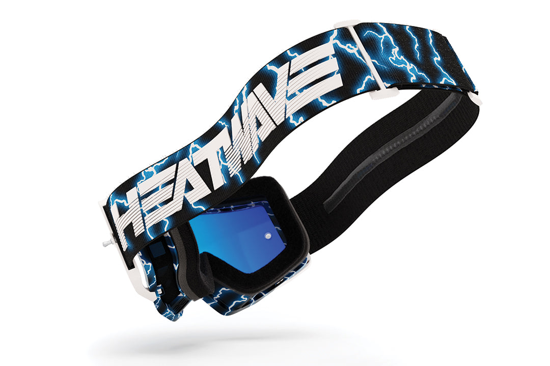 Side view of the Heat Wave Visual MXG 250 Motosport Goggle in the Lightning color way with HEATWAVE written on the strap and lightning strike designs.