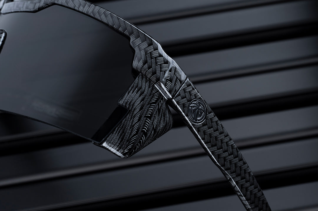 Close up angle shot of the Future Tech Sunglasses: Carbon Fiber Z87+ lens and arm