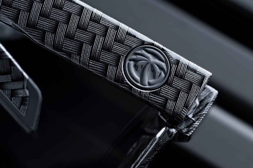 Close up back image of the Future Tech Sunglasses: Carbon Fiber Z87+ arm showing the Heat Wave Visual logo