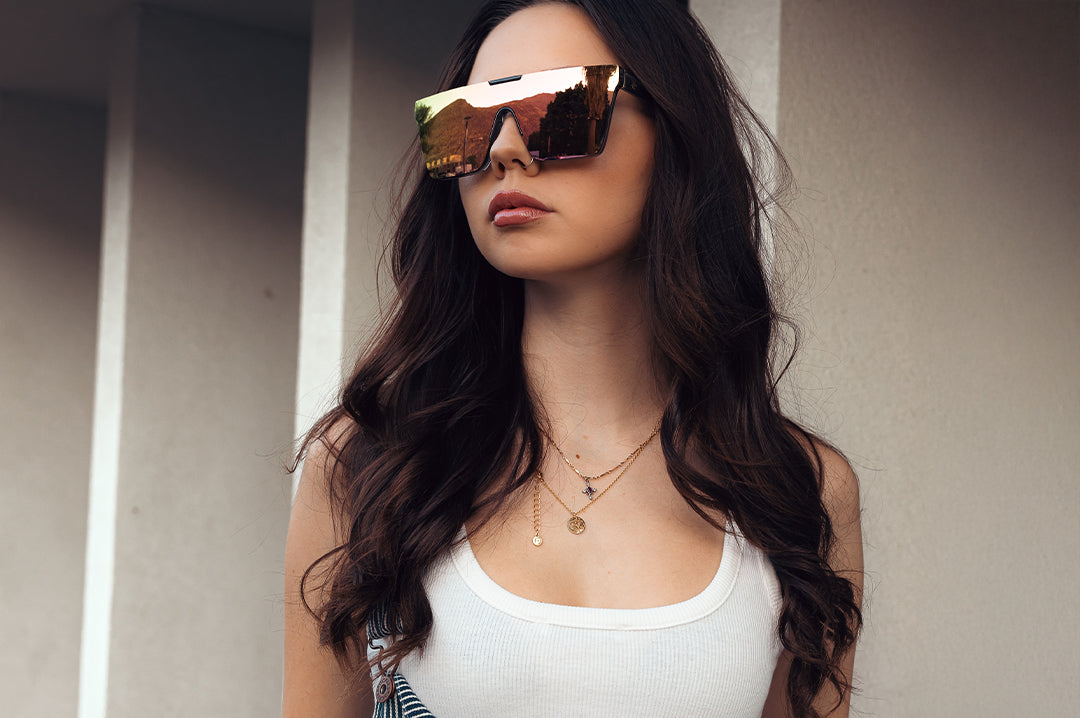 Young women rocking the Heat Wave Visual Clarity Sunglasses with quartz frames and rose gold lens.