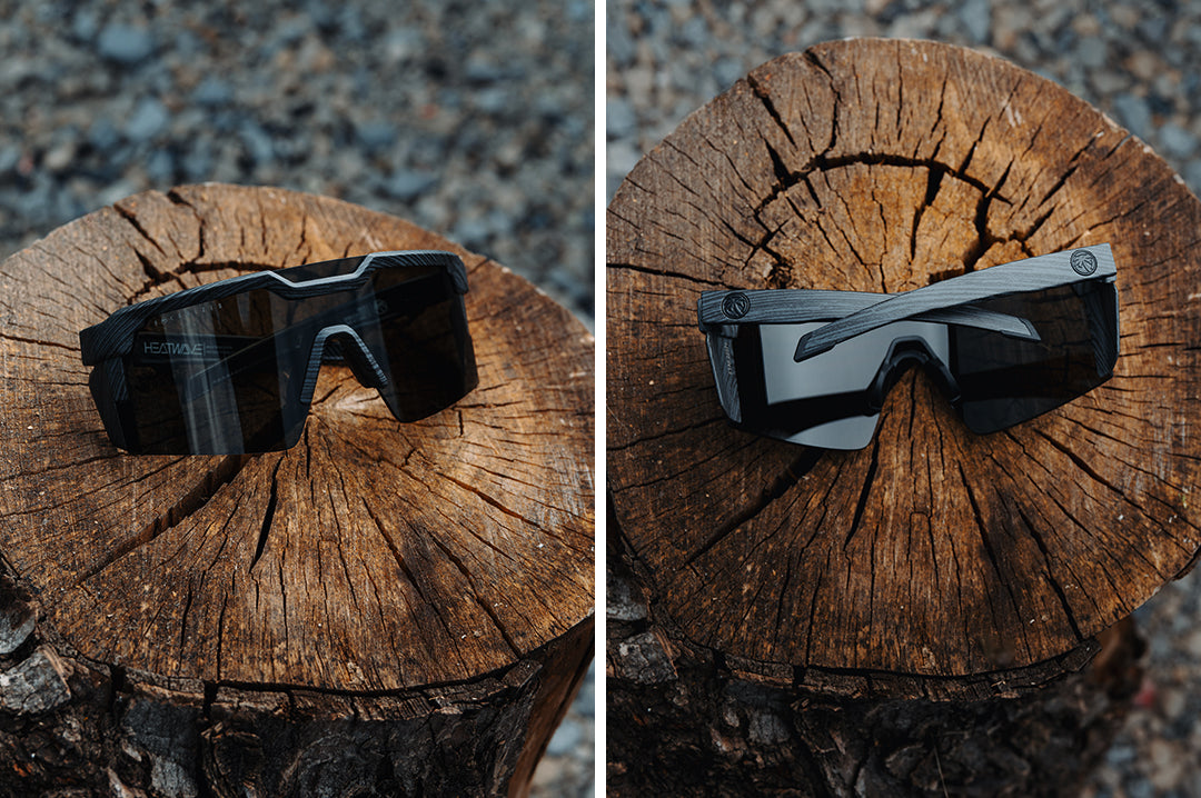 Front and back side of the Future Tech Sunglasses: Deadwood Z87+ placed on a tree stump