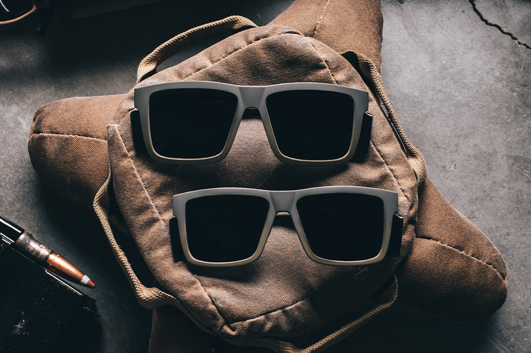 Two pairs of the Performance XL VISE Sunglasses: FDE Fader Z87+ on a brown bag