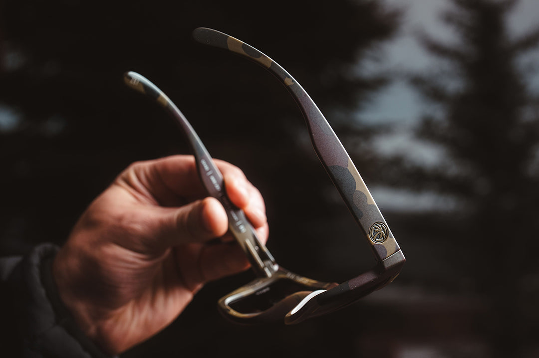 Heat Wave Visual Vise Z87 Sunglasses with fleck camo frame in hand