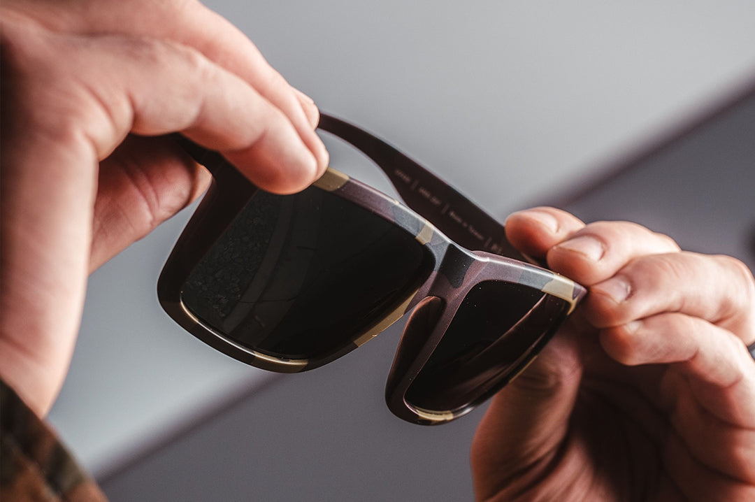 Heat Wave Visual XL Vise Z87 Sunglasses with fleck camo frame in hand