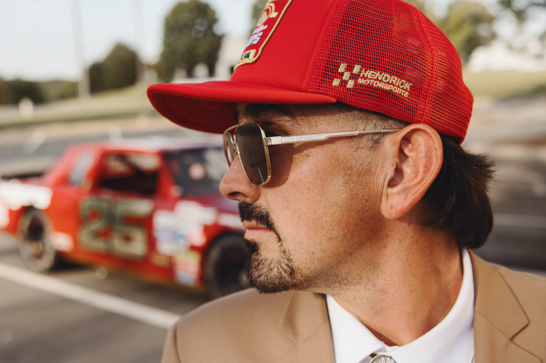Man wearing the HWV Trucker Hat: Hendrick Motorsports | Tim Richmond 25 Folgers
