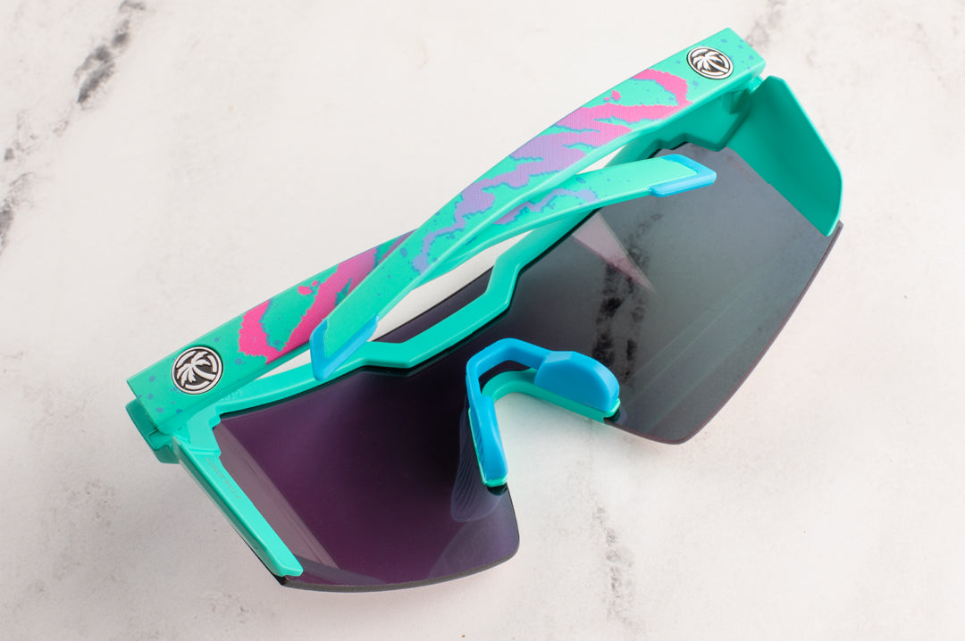 Back of the Heat Wave Visual Future Tech Sunglasses with teal frame, hypersplash print arms and spectrum pink yellow lens. 