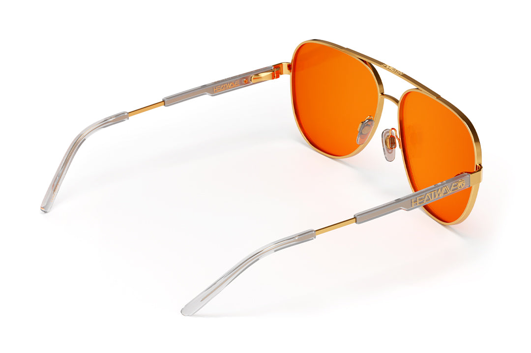 Heat Wave Visual Incline Sunglasses with polished gold frame and amber lenses.