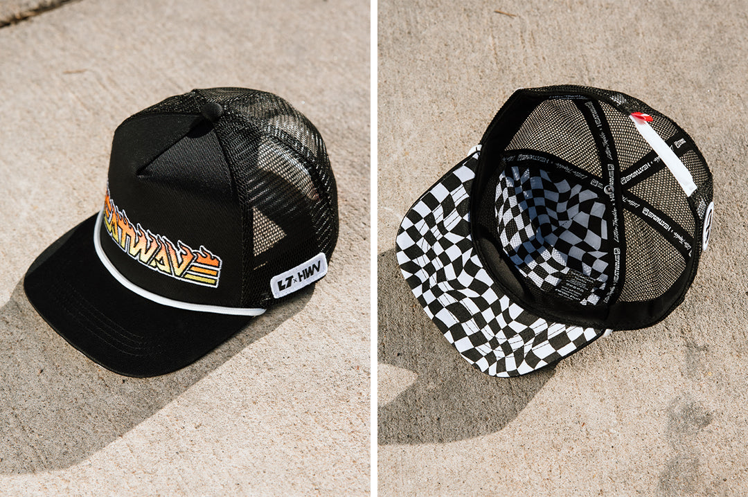 Top and bottom shot of the Little Trouble X Heat Wave Youth Trucker Hat on a concrete floor.