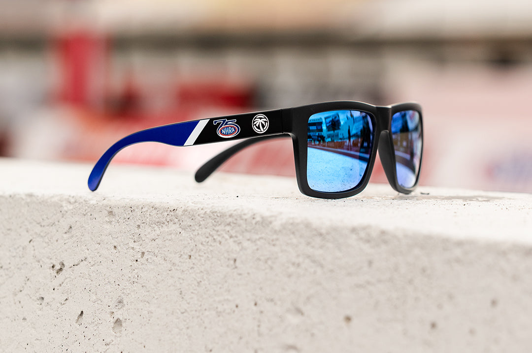 Side angle shot of the VISE Sunglasses: NHRA Customs on concrete