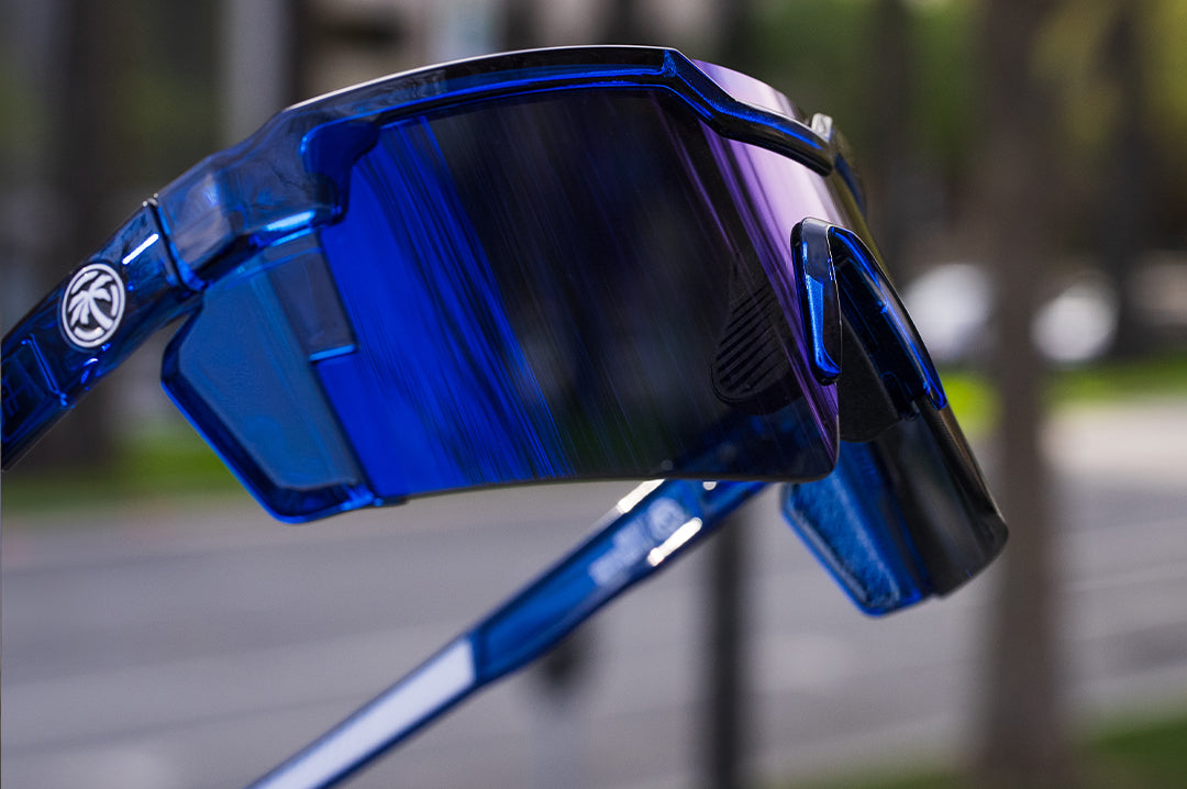 Close up of the Heat Wave Visual Future Tech Sunglasses with neon blue frame and coastal blue lens.