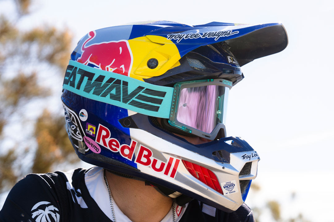Male model wearing Heat Wave Hydro Aquastone Goggles with Ultra Violet Lens and Aqua colored strap