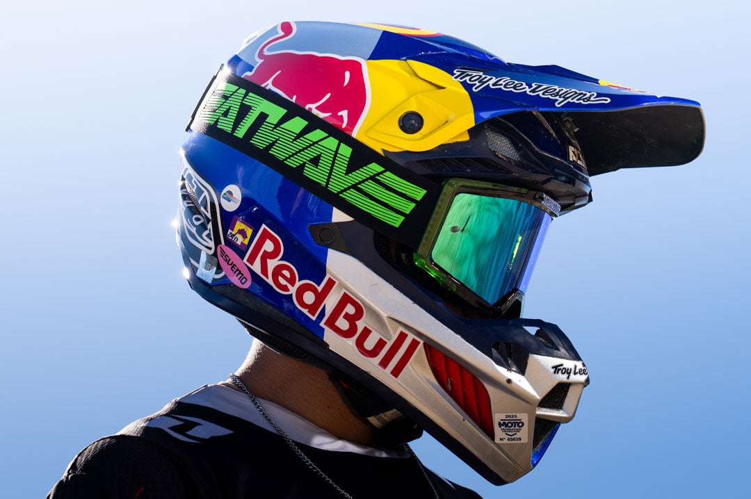 Male model wearing Heat Wave Visual MXG 250 Motorsport Goggle in the Hydro Digger color way with a Piff lens.