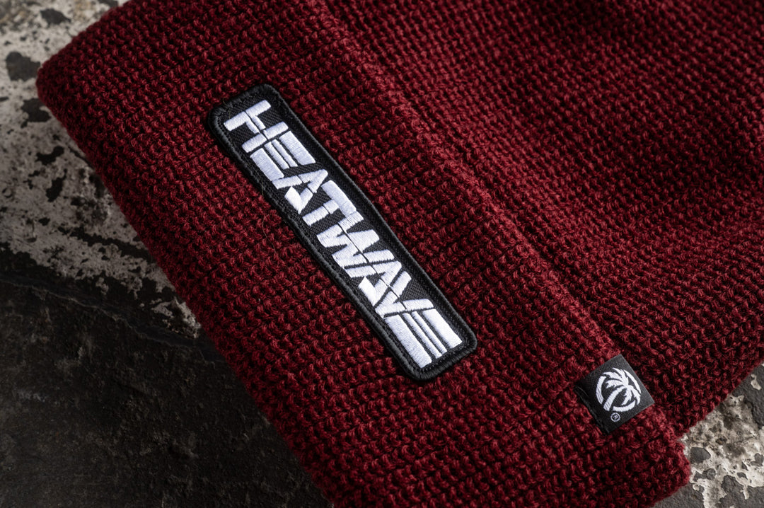 Close up of the knitted Heat Wave Visual Cardinal Red Billboard Beanie.