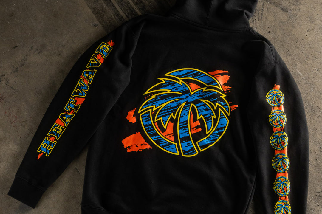 Black logo of the Heat Wave Visual Black Magic Sweatshirt. 