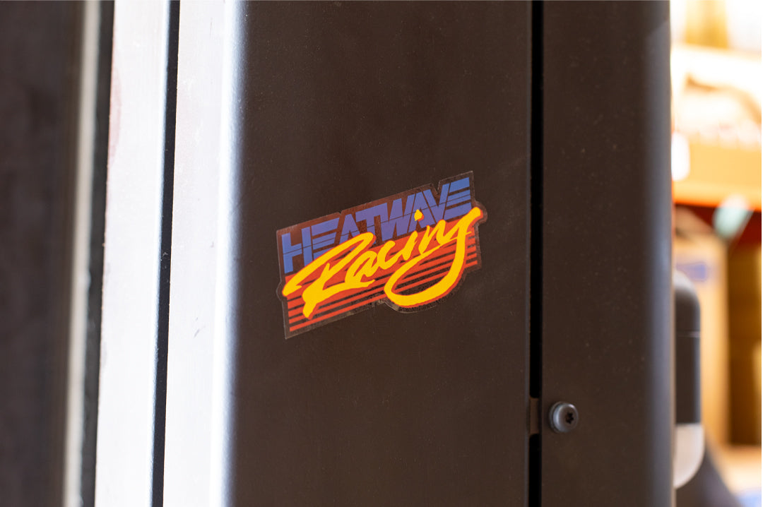 The Heat Wave Visual Racing Sticker placed on a forklift.
