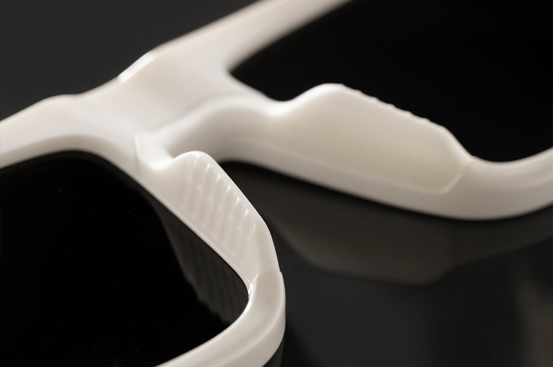 Close up shot of the backside of The Performance Rayth Sunglasses: Colby Raha 2.0 on a black background