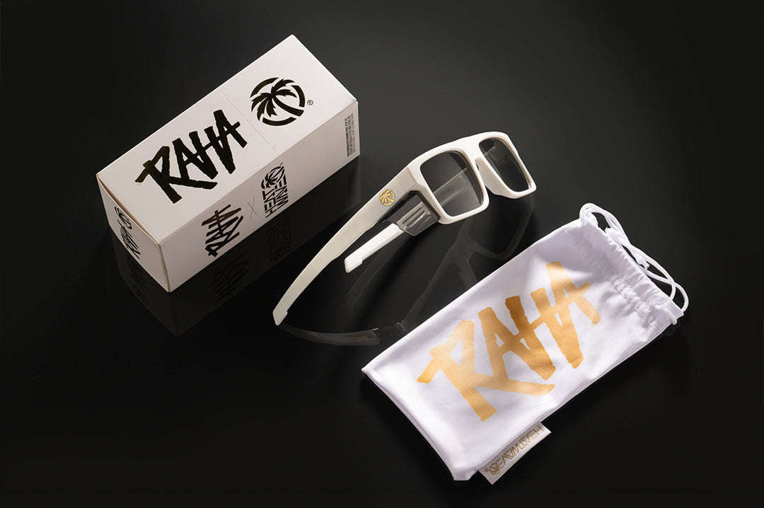 Studio shot of The Performance Rayth Sunglasses: Colby Raha 2.0 on a black background with the carry bag and product box