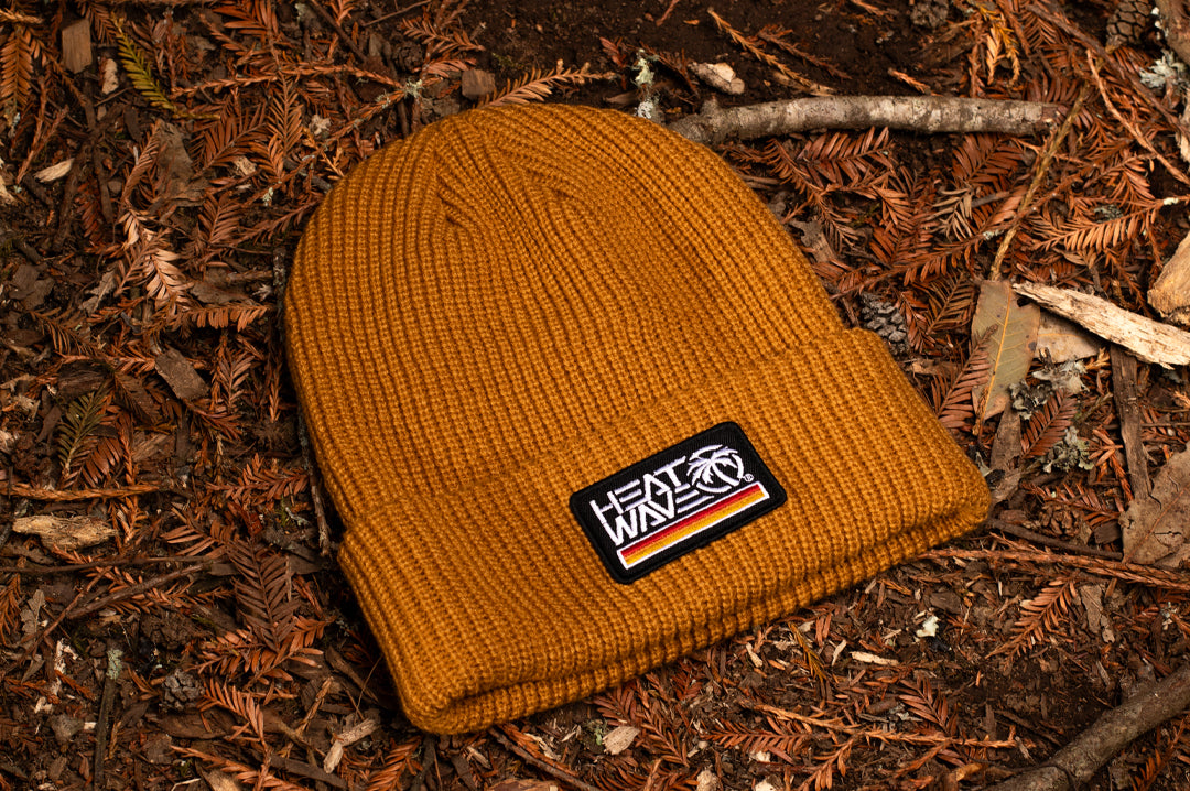 Lying amongst the fall leaves is the Heat Wave Visual Retro Stripe Beanie.